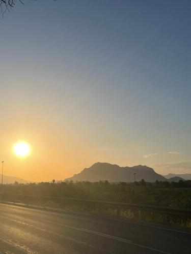 a sunset on the side of a road at Casa Amarela Guesthouse, Algorfa in Algorfa