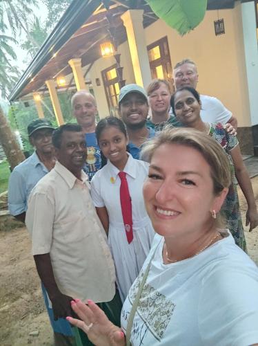 a group of people posing for a picture at Serene Bliss Villa in Unawatuna