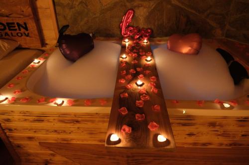 a bath tub with lights on the side of it at Özden Bungalow in Çamlıhemşin