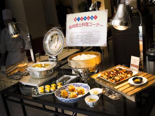 a buffet with various food items on a table at Hotel Den Haag Huis Ten Bosch in Sasebo