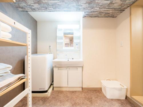 a bathroom with a sink and a mirror at Shinjuku, 1min walk from Kagurazaka Sta ,80square meters,net, PocketWiFi, Switch in Tokyo