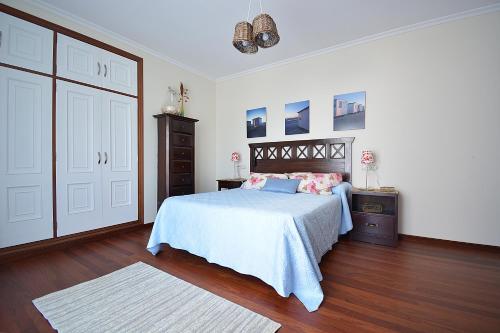 Ένα ή περισσότερα κρεβάτια σε δωμάτιο στο Apartamento con terraza en el entorno de Sanxenxo