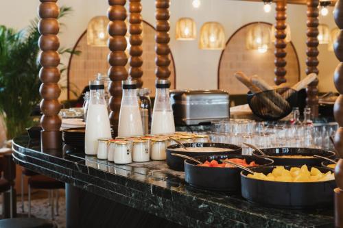 a buffet with food and drinks on a table at Crowne Plaza Lyon - Cité Internationale in Lyon