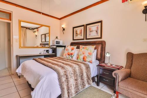Ένα ή περισσότερα κρεβάτια σε δωμάτιο στο Cascade Villa Guesthouse
