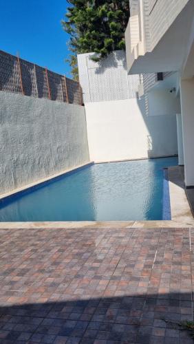 a swimming pool in front of a house at Oceana Mazagan Suites Hotel in El Jadida