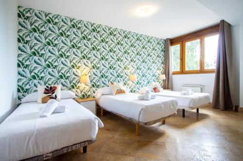 Postel nebo postele na pokoji v ubytování Apartamentos Villablino Arturo Soria