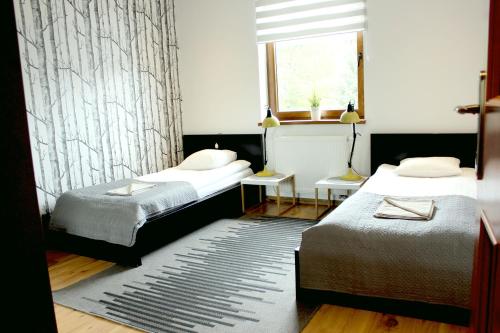 Posteľ alebo postele v izbe v ubytovaní Apartament 007A pod Śnieżką