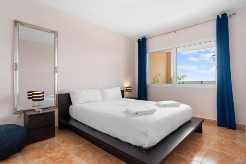 Ένα ή περισσότερα κρεβάτια σε δωμάτιο στο Roque del Conde Aragon