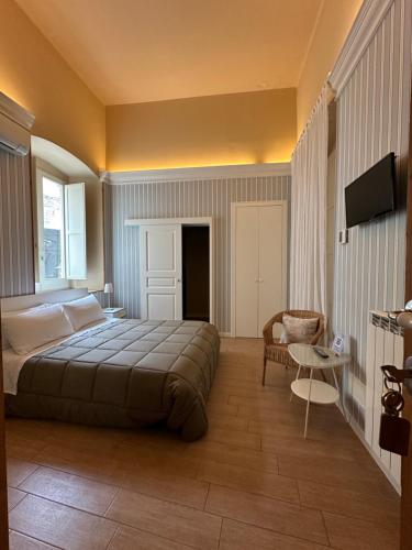 Una cama o camas en una habitación de b&b Arco Pinto