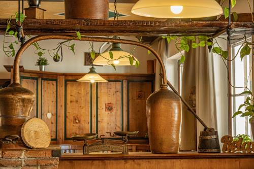 a room with a mirror and some vases on a counter at Landhotel Mariensäule in Wernstein am Inn