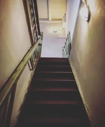 a stairway in a building with a bunch of stairs at LEJU 8 樂居 Loft living with open air bathroom in Melaka