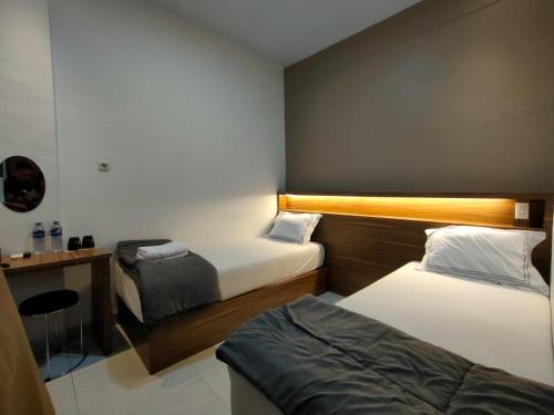 Krevet ili kreveti u jedinici u okviru objekta Horas Hotel