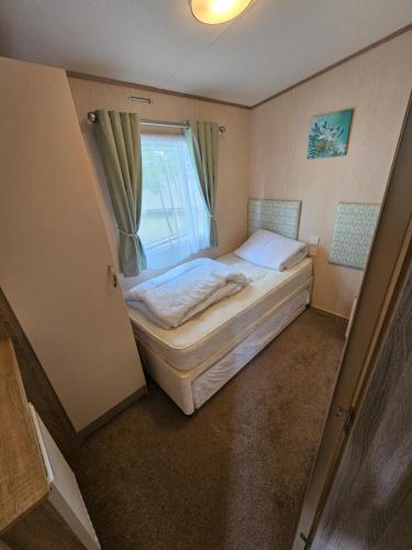 Ένα ή περισσότερα κρεβάτια σε δωμάτιο στο 3 Bed Holiday Home, Doniford Bay