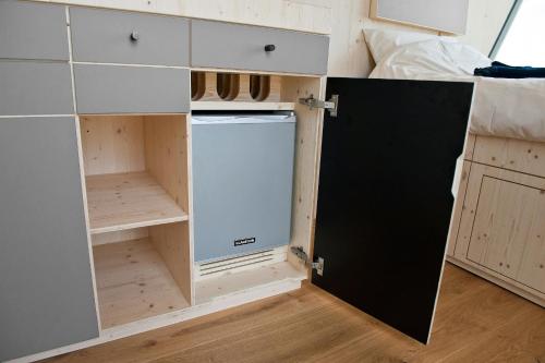 a washer and dryer in a cabinet in a room at Sleep Space 3 - Salemer See in Salem