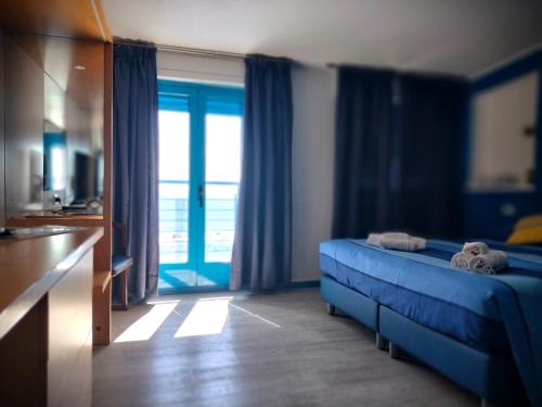 Кровать или кровати в номере La Favorita Hotel