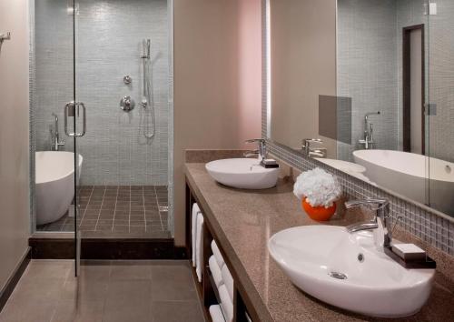 a bathroom with two sinks and a shower at Grand Hyatt San Francisco Union Square in San Francisco