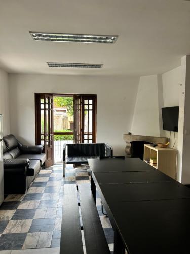 a living room with a couch and a table at Asprela Guest House in Porto