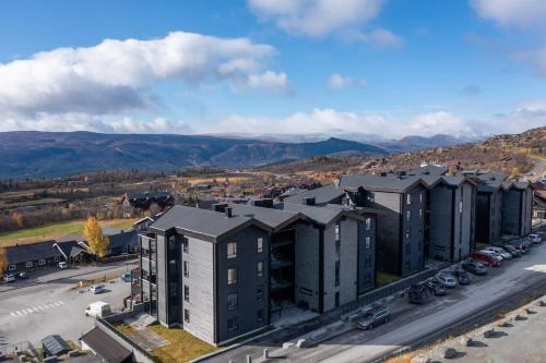 an aerial view of a building with a parking lot at Riddertunet Beitostølen in Beitostøl