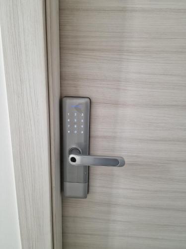 a door with a handle on a wooden door at Tower Apartments in Terracina