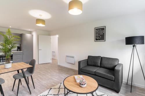 a living room with a couch and a table at Host & Stay - 36 Waterside Place in Taunton