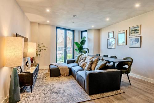 a living room with a couch and a table at City Retreat with Parking at Apartment 26 in York