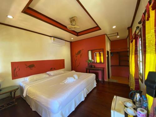 מיטה או מיטות בחדר ב-Kinnaree Resort Koh Kood