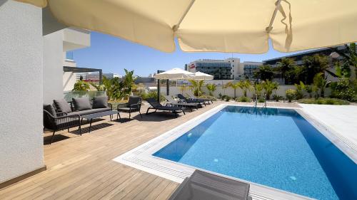 a swimming pool on the roof of a building at City Napa Seaview Villas - Villa 6 in Ayia Napa