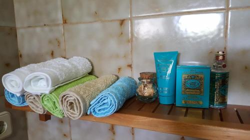 a shelf with towels and other items on it at Quinta da Lage in Barcelos