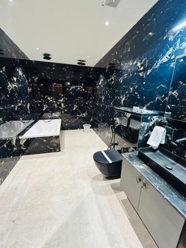 a bathroom with a sink and a toilet in it at Taj Dream A Luxury Hotel - Agra in Agra