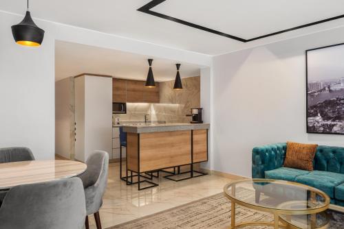 a living room with a couch and a table at Radisson Residences Cairo Heliopolis in Cairo