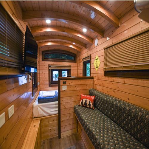 a living room with a couch and a bedroom at Camptel Poconos in Albrightsville