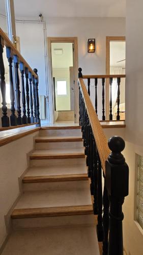 a staircase in a house with a stair case at Villadora in Santa Coloma de Farners