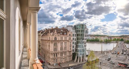 a view of a building with a glass tower at River Dance Suites by Adrez in Prague
