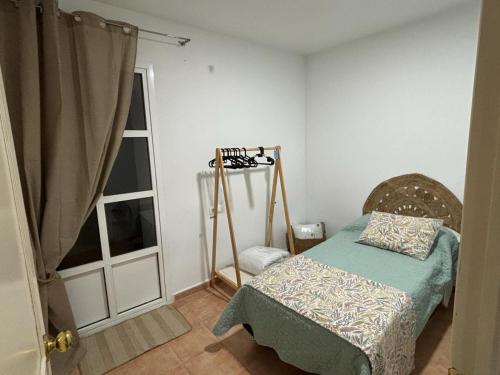 Cama ou camas em um quarto em Apartamento La Jerezana