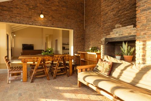 a living room with a couch and a dining room at Wolfkop Nature Reserve in Citrusdal