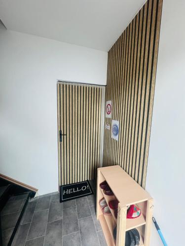 a room with a wooden table and a door at Naturblick Sollstedt FeWo in Sollstedt
