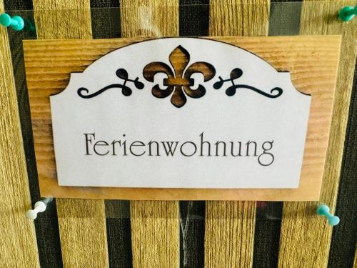 a sign on a table with the word feilding at Sollstedt Paradies 