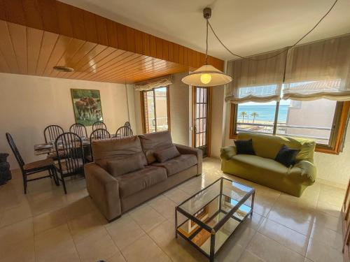 a living room with a couch and a table at Apartment Escor in Segur de Calafell