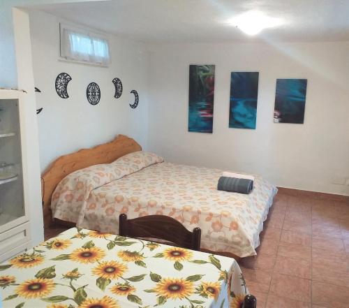 Giường trong phòng chung tại Casetta Lago di Paola Sabaudia - San Felice Circeo