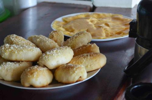 a plate of dumplings and pancakes on a table at Pousada Tranquila in Morro de São Paulo
