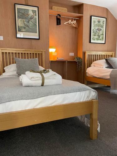 a room with two beds in a room at The Cross Inn in Hebden Bridge