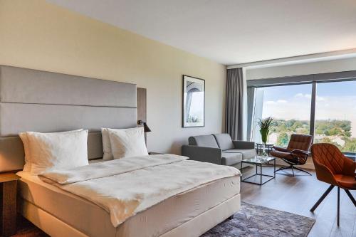Postel nebo postele na pokoji v ubytování Radisson Blu Hotel Frankfurt