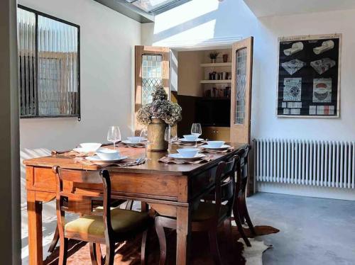 a dining room with a wooden table and chairs at Luxury City Centre Townhouse - Sleeps 6 in Chester