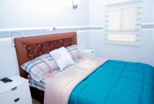 Llit o llits en una habitació de NK HOME
