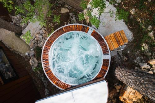 an overhead view of a pool of water in a bowl at Theodosius Forest Village - Glamping in Vipava valley in Vipava