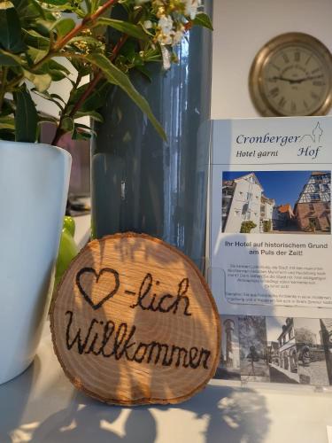 a sign that reads high willemia sitting on a table at Hotel Cronberger Hof in Ladenburg