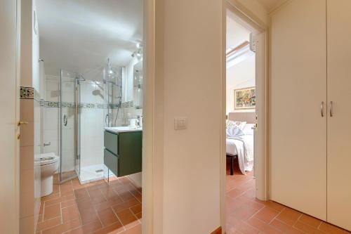 a bathroom with a shower and a sink and a toilet at Poggio Imperiale Apartment by Mamo Florence in Florence