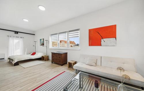 a living room with a couch and a bed at Beautiful Apartment In Eilenburg in Eilenburg