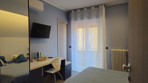 TV a/nebo společenská místnost v ubytování Real Rooms Dalia