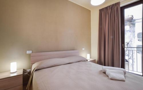 Ένα ή περισσότερα κρεβάτια σε δωμάτιο στο Le Muse Apartments